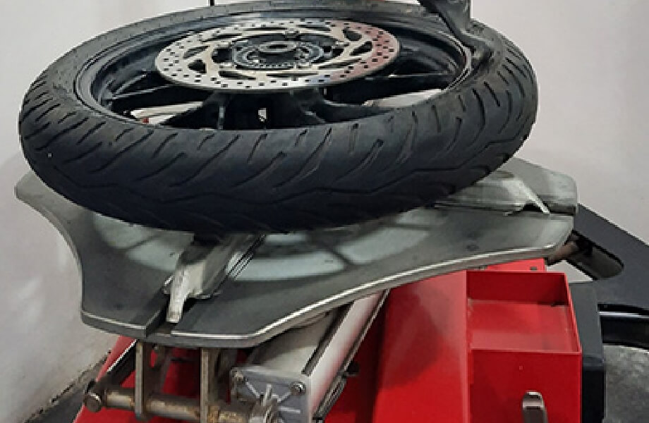Specialized Two-Wheeler Tyre Changer with Rim Adaptors.